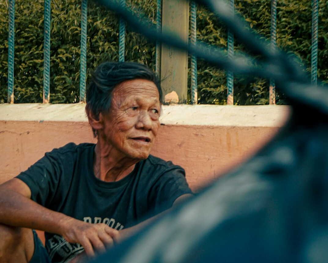 Portrait of an older Latino man photographer