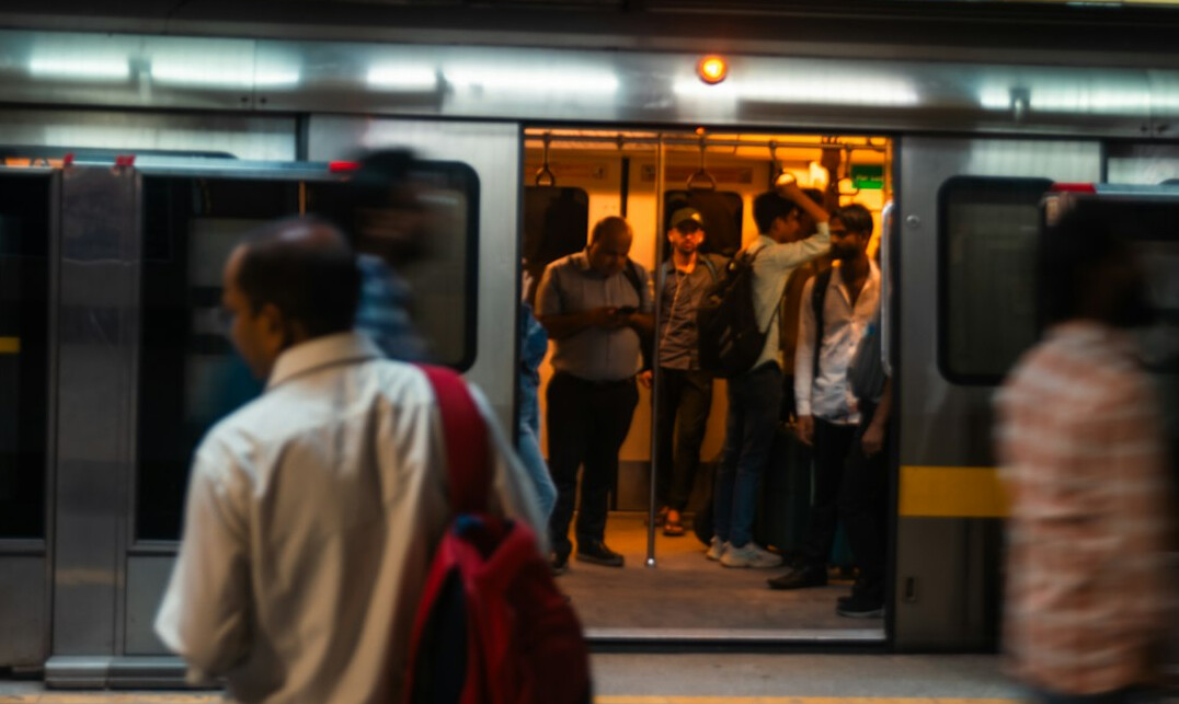 Commuters waiting on a busy metro platform